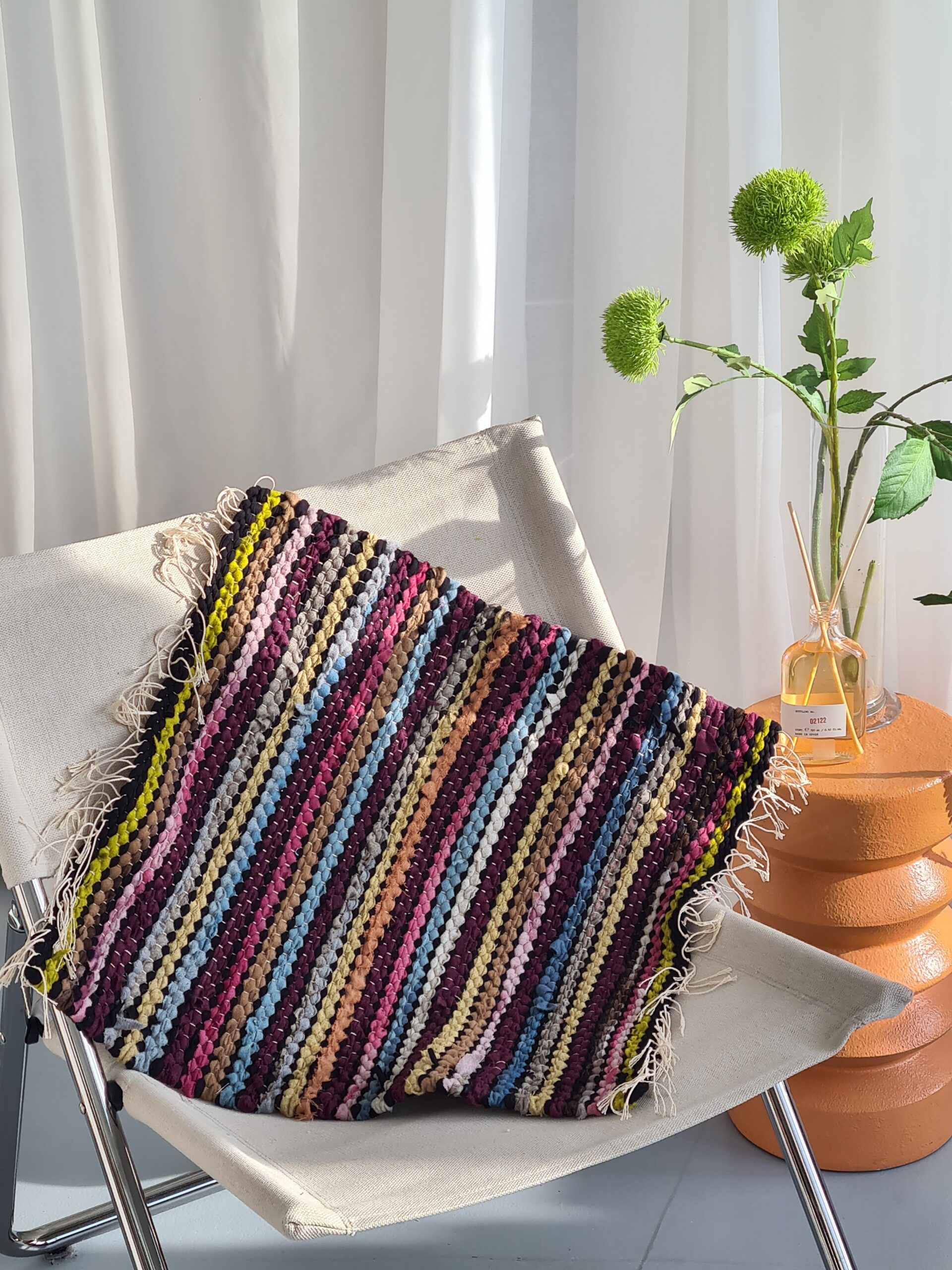 HAND WOVEN RUG MADE WITH UPCYCLED MATERIALS