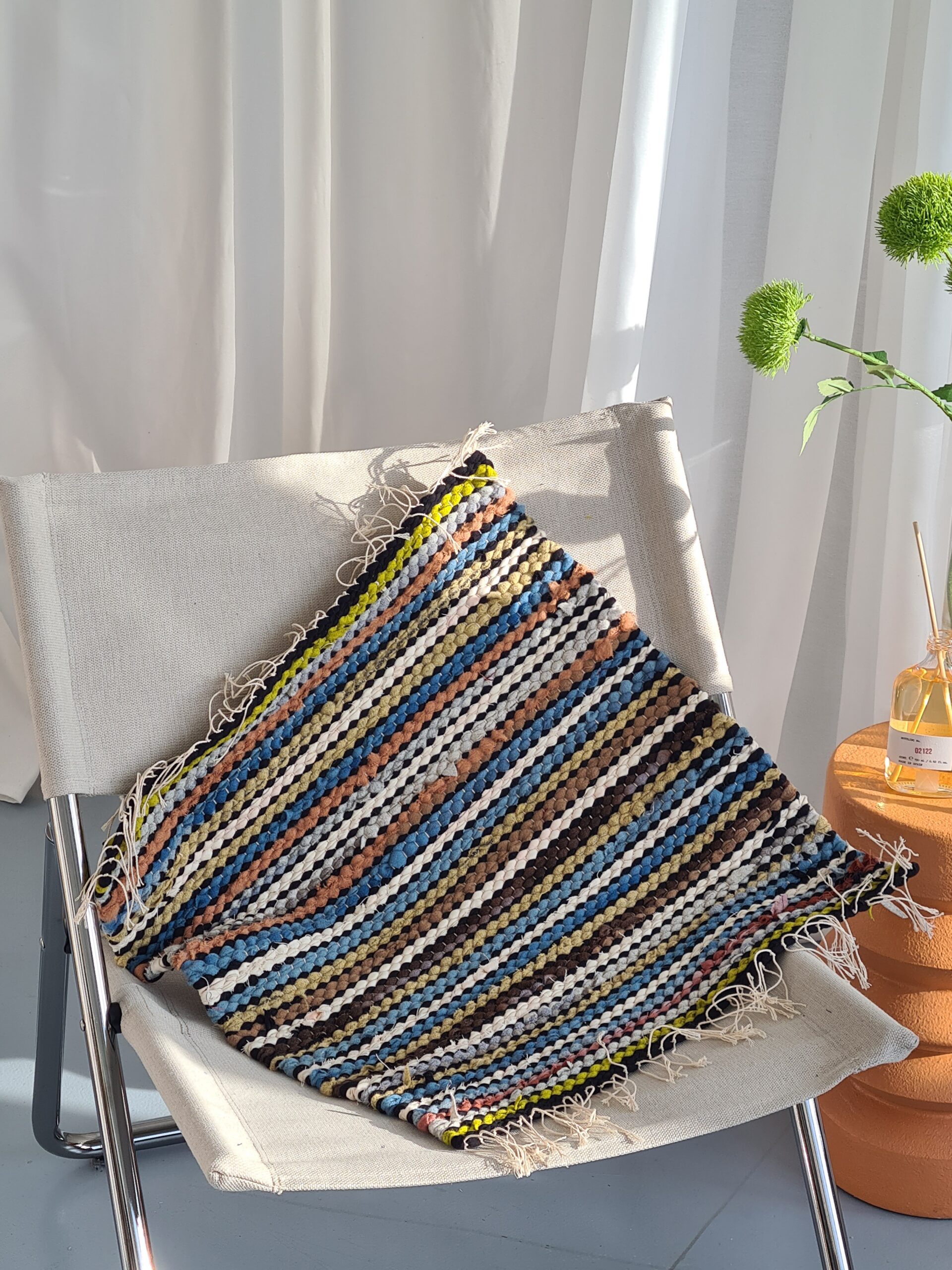 HAND WOVEN RUG MADE WITH UPCYCLED MATERIALS